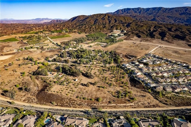 birds eye view of property featuring a mountain view