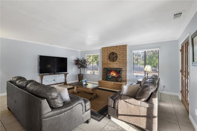 tiled living room featuring ornamental molding, a brick fireplace, and plenty of natural light