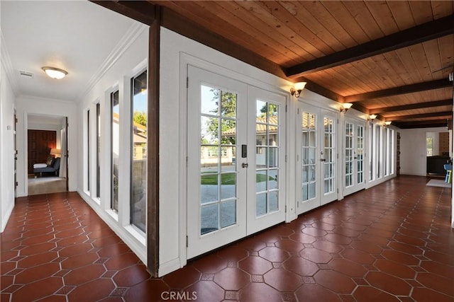 doorway with plenty of natural light, wooden ceiling, beam ceiling, and french doors