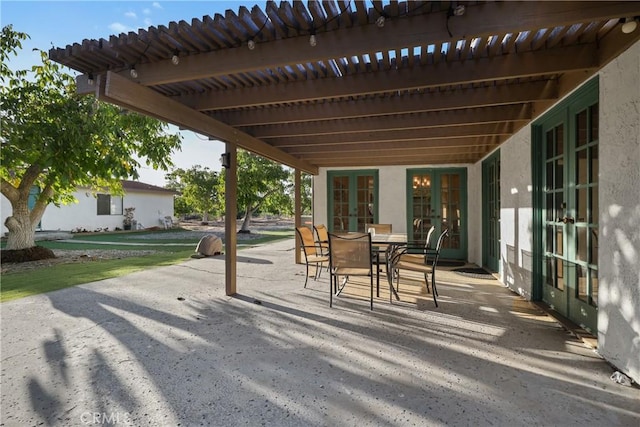 view of patio / terrace featuring french doors and a pergola