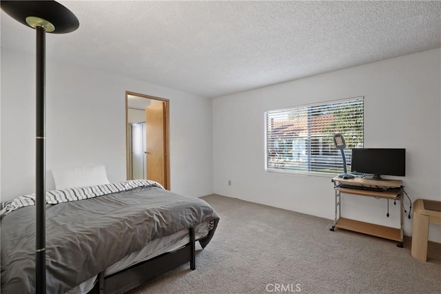 carpeted bedroom with a textured ceiling