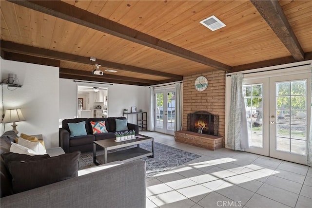 living room with light tile patterned flooring, a fireplace, wooden ceiling, beam ceiling, and french doors