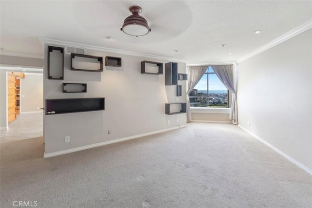 unfurnished living room featuring ornamental molding and light carpet