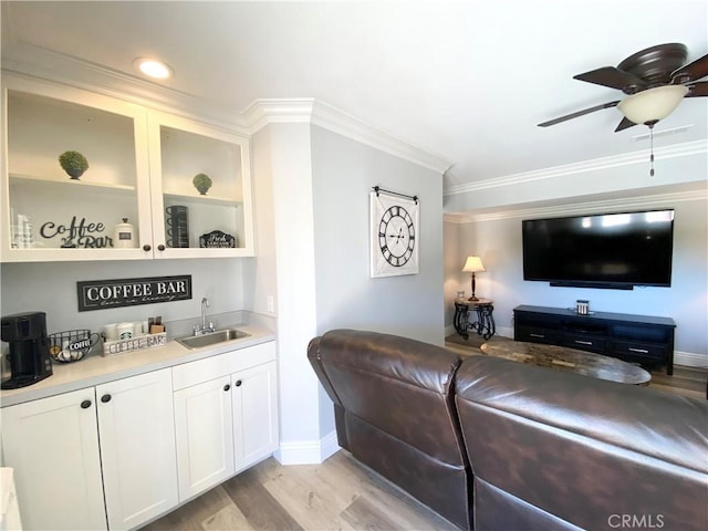 22761 Granite Dome Pl, Canyon Lake, CA 92587 - living room featuring ceiling fan, ornamental molding, light hardwood / wood-style flooring, and indoor wet bar