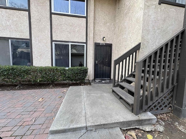 doorway to property with a patio