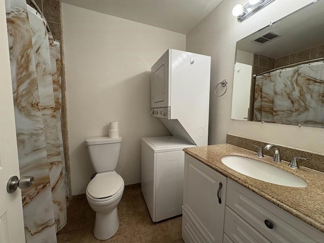 bathroom with vanity, stacked washer and clothes dryer, toilet, and a shower with curtain