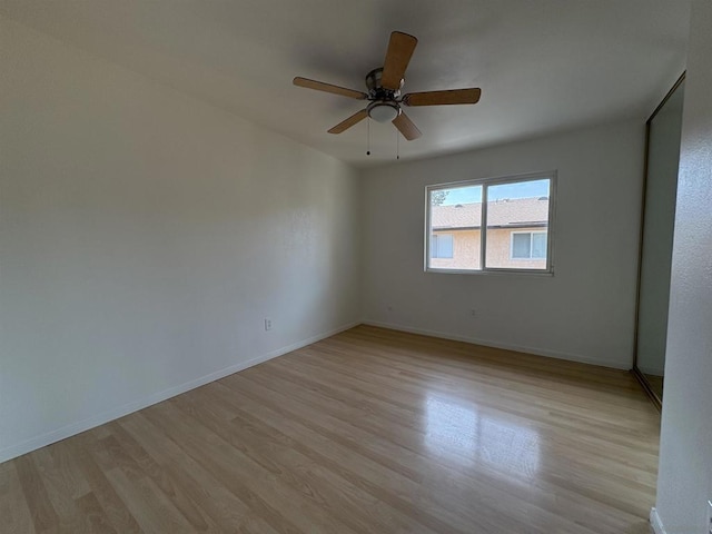 spare room featuring ceiling fan and light hardwood / wood-style flooring