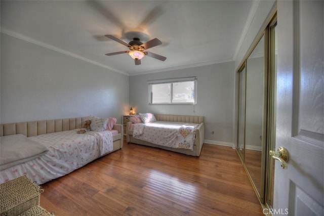 779 W 24th Unit 4, San Pedro, CA 90731 - bedroom with crown molding, wood finished floors, a ceiling fan, and a closet
