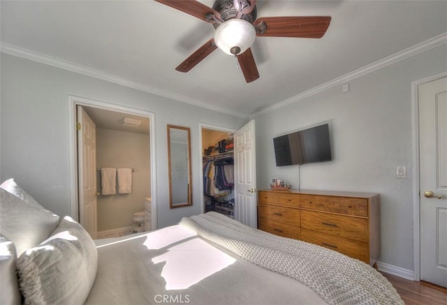 779 W 24th Unit 4, San Pedro, CA 90731 - bedroom featuring ornamental molding, connected bathroom, a walk in closet, a closet, and wood finished floors