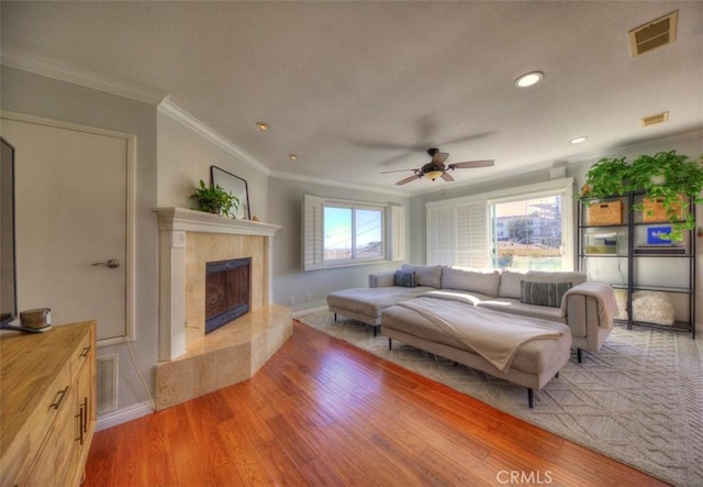 779 W 24th Unit 4, San Pedro, CA 90731 - living area featuring ornamental molding, light wood-style floors, a high end fireplace, a ceiling fan, and recessed lighting