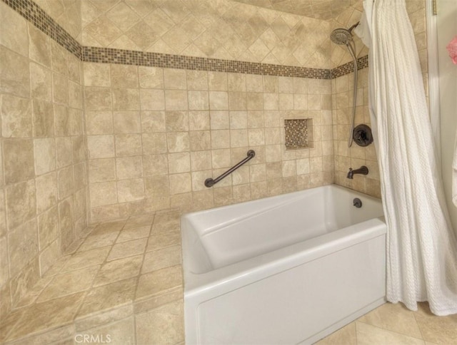 bathroom featuring shower / tub combo with curtain and tile patterned floors