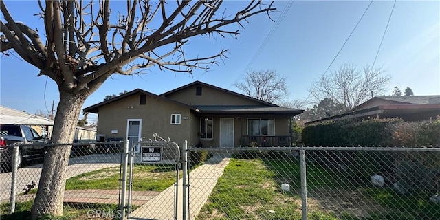 bungalow-style home with a front lawn