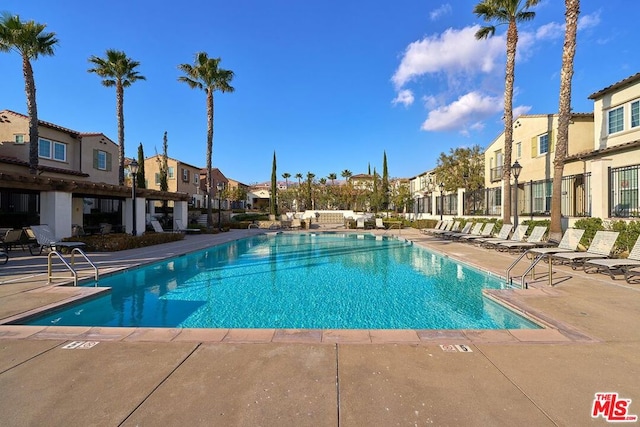 view of swimming pool with a patio area