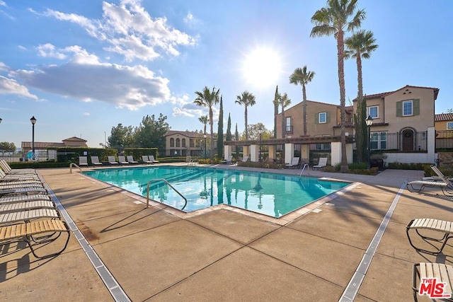 view of swimming pool with a patio area