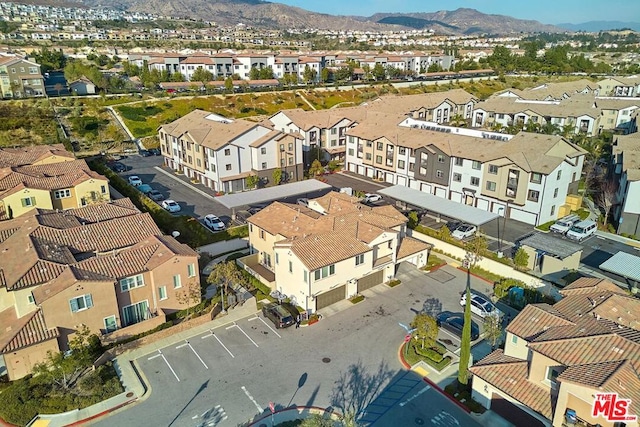 birds eye view of property featuring a mountain view