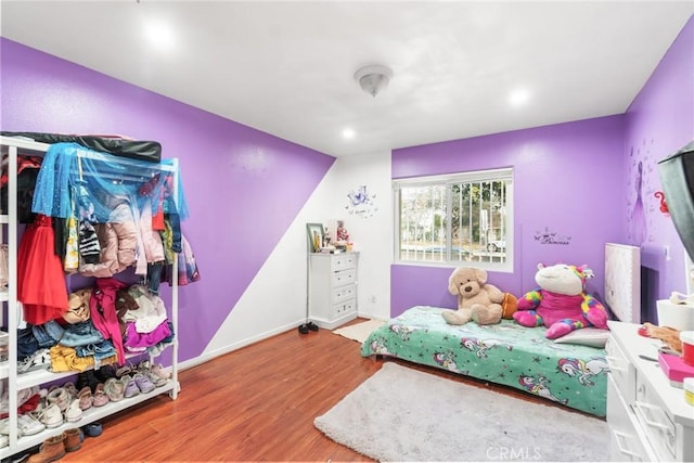 bedroom with hardwood / wood-style flooring