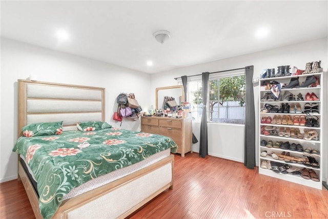 bedroom featuring hardwood / wood-style floors