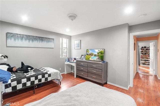 bedroom with light hardwood / wood-style floors