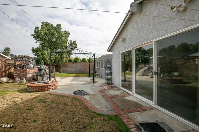 view of yard with a gazebo, a fire pit, and a patio