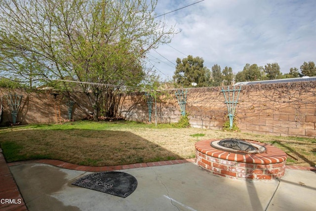 view of yard with a patio area and a fire pit