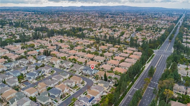 birds eye view of property with a mountain view