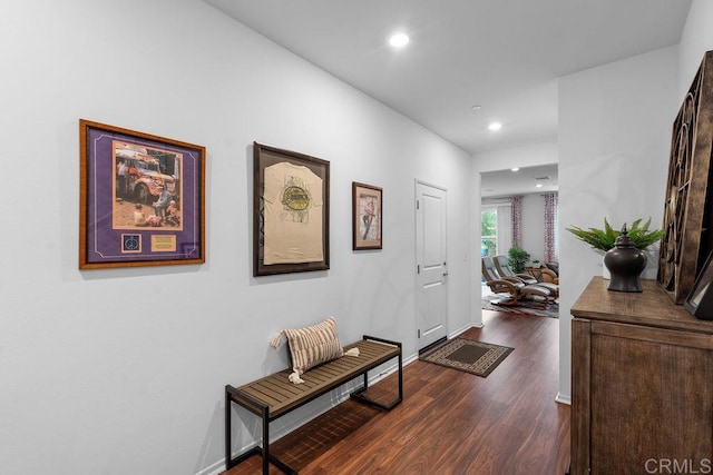 hall with dark wood-type flooring