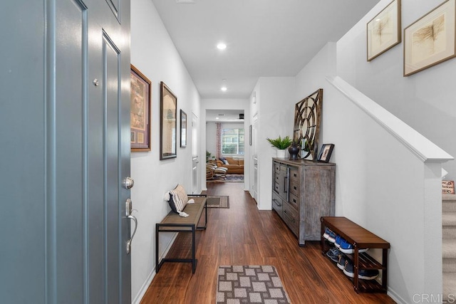 hallway with dark hardwood / wood-style floors