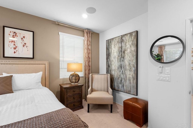 bedroom featuring light carpet