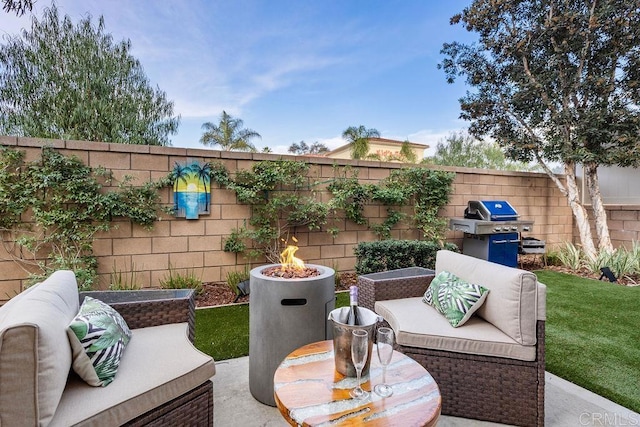 view of patio featuring an outdoor living space with a fire pit