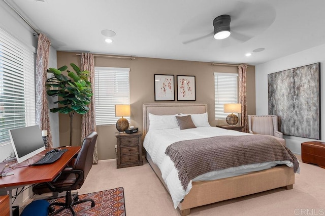 bedroom featuring light carpet and ceiling fan