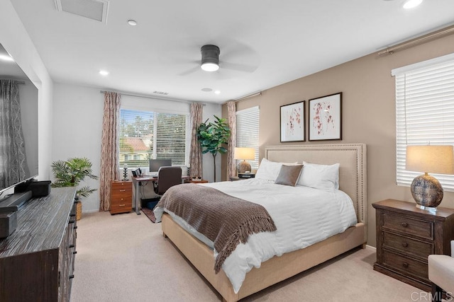 bedroom with ceiling fan, recessed lighting, visible vents, and light colored carpet