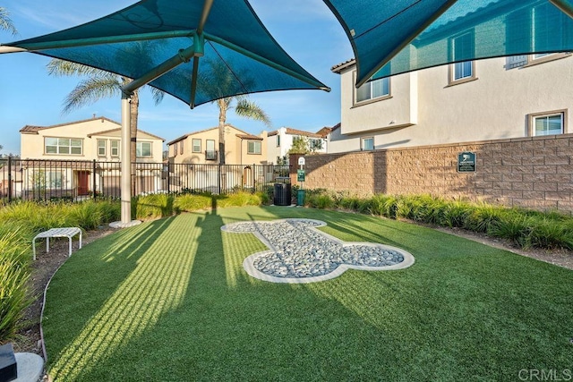 view of yard with fence and a residential view