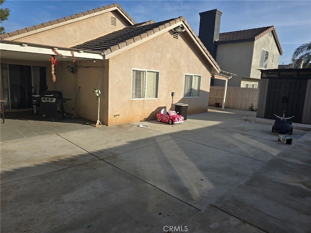 rear view of house featuring a patio