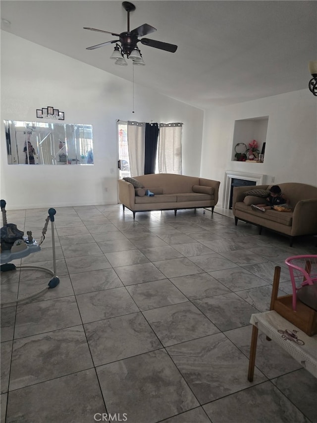 living room featuring vaulted ceiling and ceiling fan