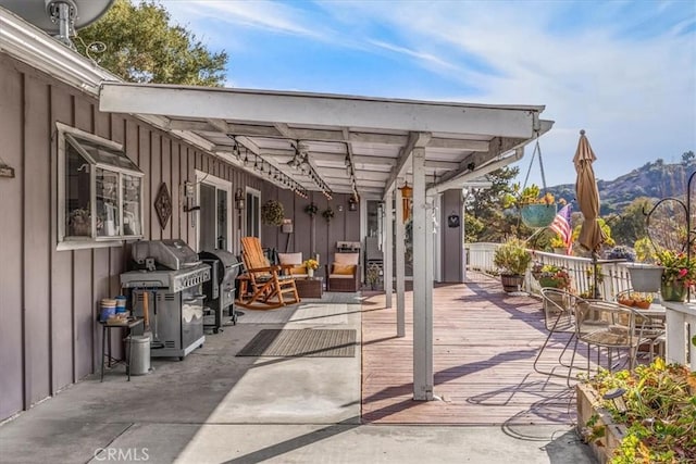 view of patio / terrace with a mountain view and area for grilling