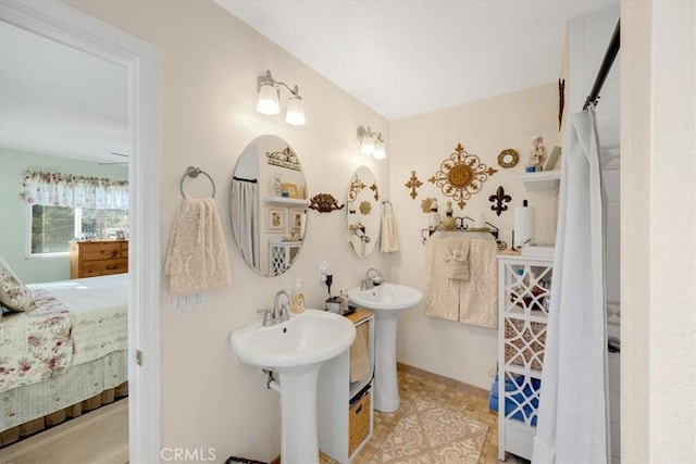 bathroom featuring dual sinks