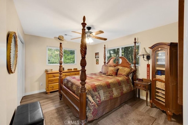 bedroom featuring hardwood / wood-style flooring and ceiling fan