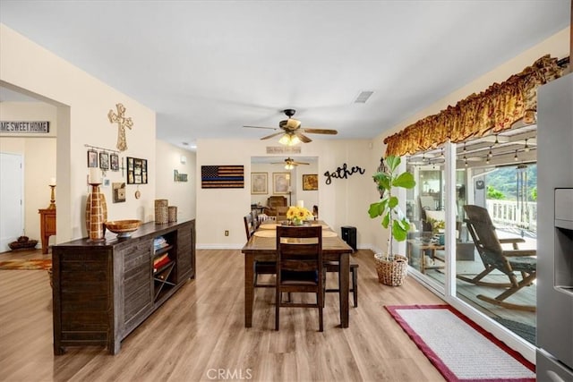 dining space featuring light hardwood / wood-style flooring and ceiling fan