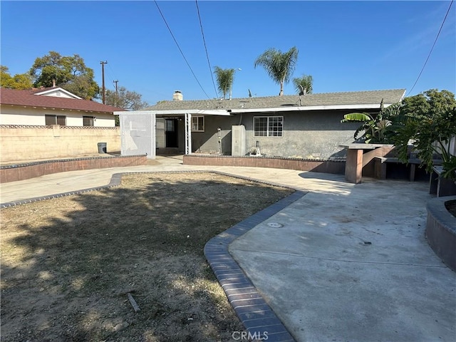 rear view of house featuring a patio