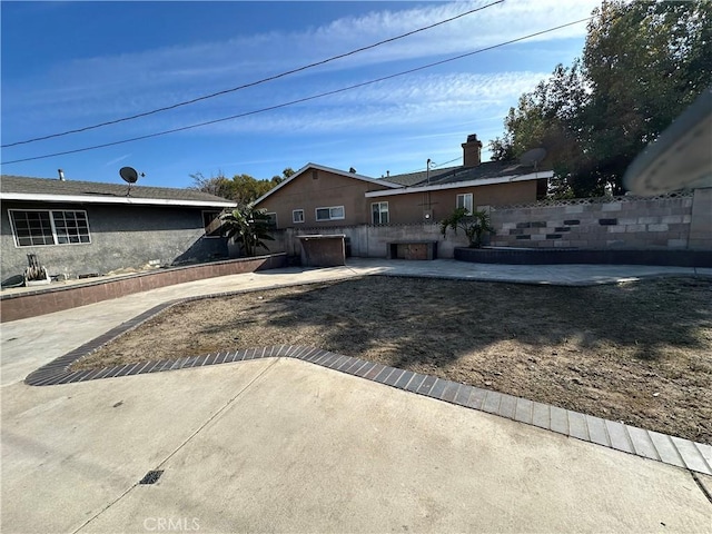 single story home featuring a patio area