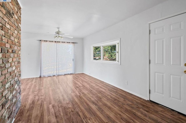 interior space featuring ceiling fan and dark hardwood / wood-style flooring