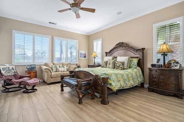 bedroom featuring crown molding, ceiling fan, and light wood-type flooring