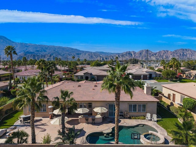 birds eye view of property featuring a mountain view