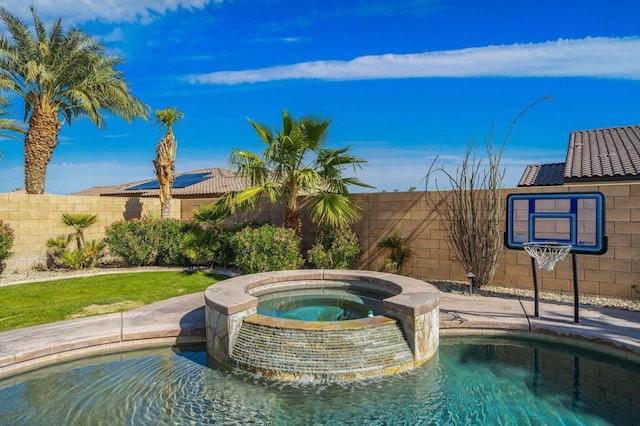 view of swimming pool featuring an in ground hot tub