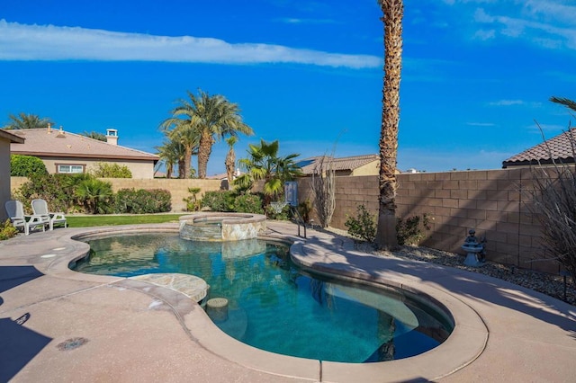 view of swimming pool with an in ground hot tub and a patio