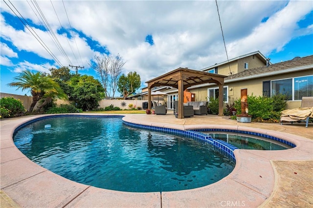 view of swimming pool featuring a gazebo, an in ground hot tub, outdoor lounge area, and a patio