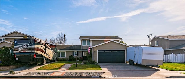 front of property with a garage and a front lawn