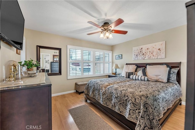 bedroom featuring ceiling fan and light wood-type flooring