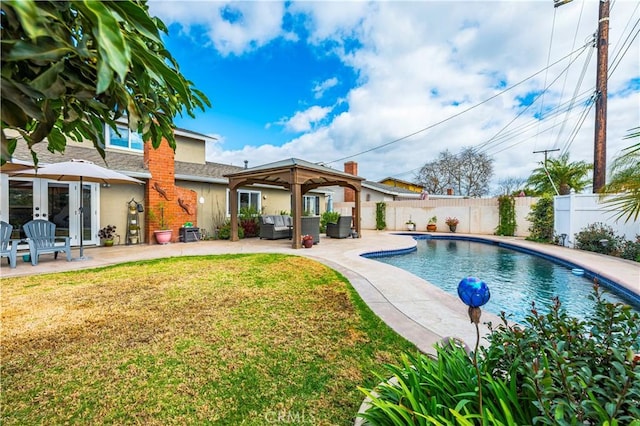 view of pool featuring a patio, outdoor lounge area, a yard, a gazebo, and french doors