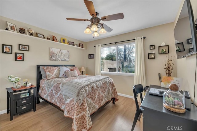 bedroom featuring ceiling fan and light hardwood / wood-style flooring